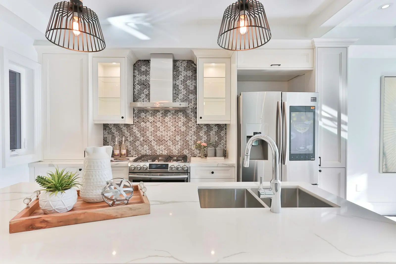 Modular kitchen after renovation with white cabinets and new appliances